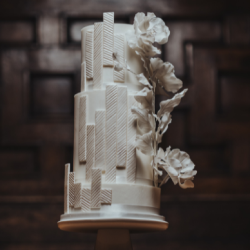 three-tier Diamond white wedding cake inspired by the bride's shoes, dress and bouquet